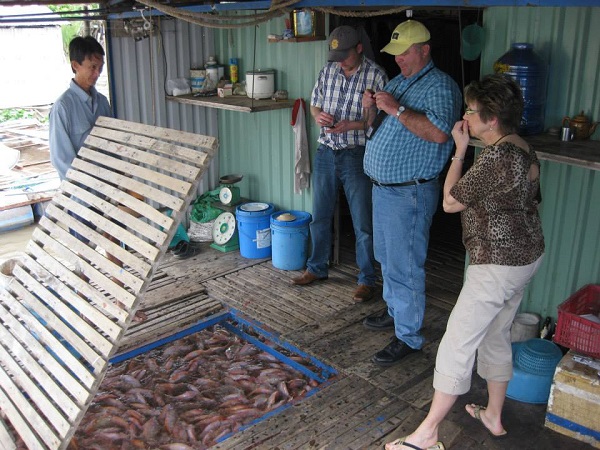 farm tour packages to Vietnam from USA with a fish farmer