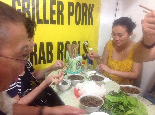 Eating Bun Cha - Grilled pork with noolde on Vietnam Hanoi Travel