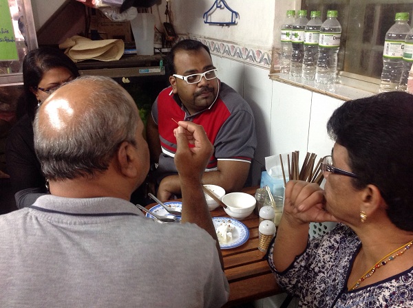 Eating Banh Cuon Bao Khanh on North vietnam tours Hanoi for 4 Clients from Malaysia